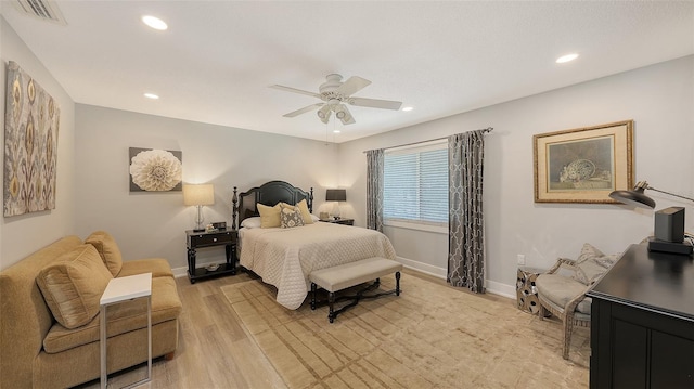 bedroom with ceiling fan and light wood-type flooring