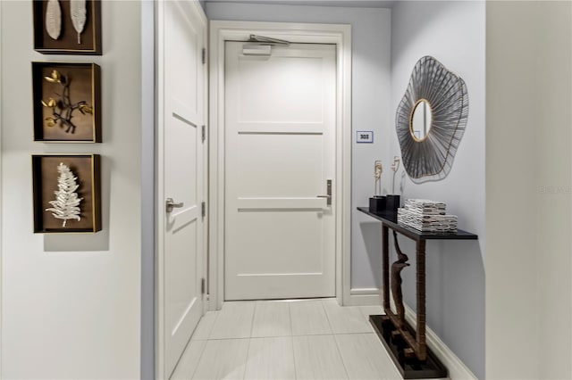 entryway featuring light tile patterned floors