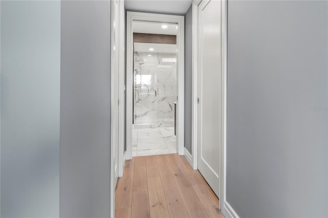 hallway with light wood-type flooring