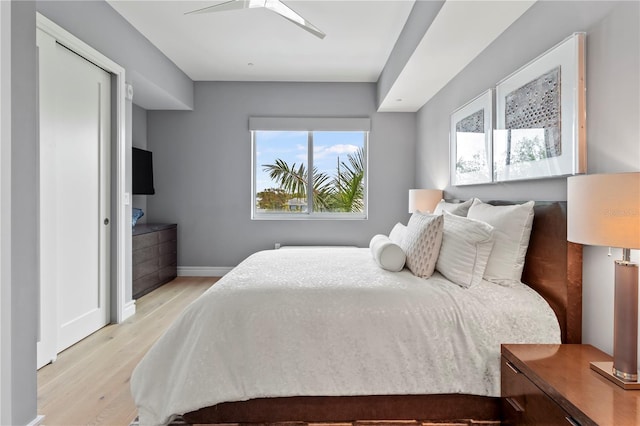 bedroom featuring ceiling fan and light wood-type flooring