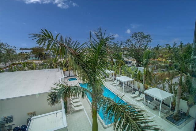 balcony with a patio and a community hot tub