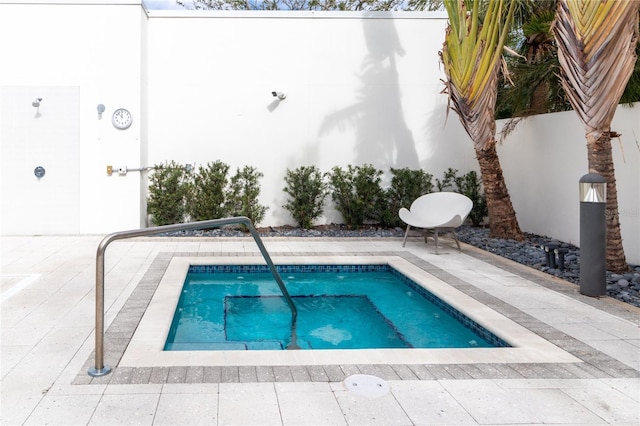 view of swimming pool featuring a patio