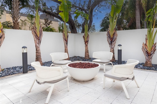 view of patio / terrace with an outdoor fire pit