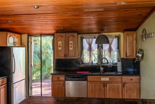 kitchen with sink, wooden ceiling, backsplash, decorative light fixtures, and appliances with stainless steel finishes