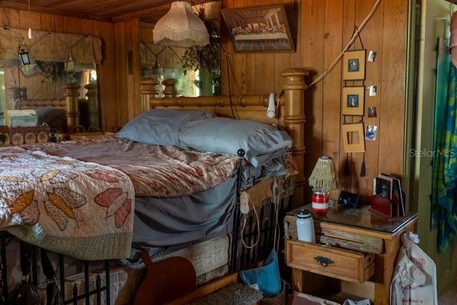 bedroom with wood walls and wood ceiling