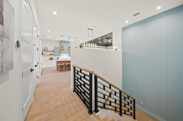 corridor featuring light hardwood / wood-style floors