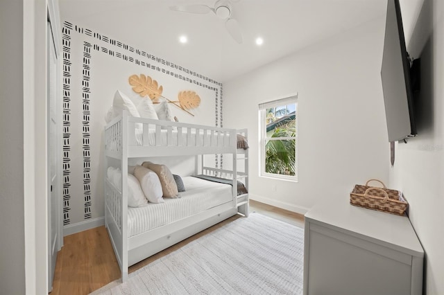 bedroom featuring ceiling fan and light hardwood / wood-style flooring