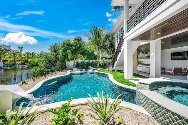 view of pool featuring a patio area and a water view