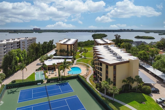 birds eye view of property with a water view