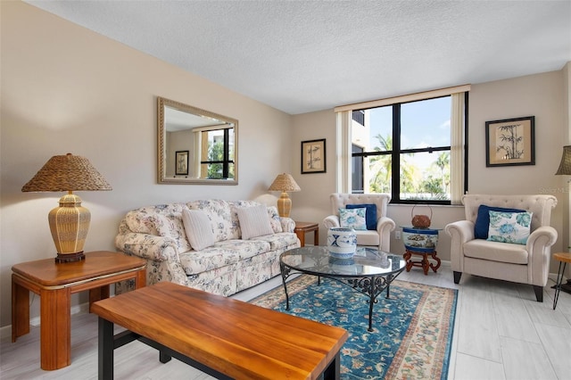 living room with a healthy amount of sunlight and a textured ceiling