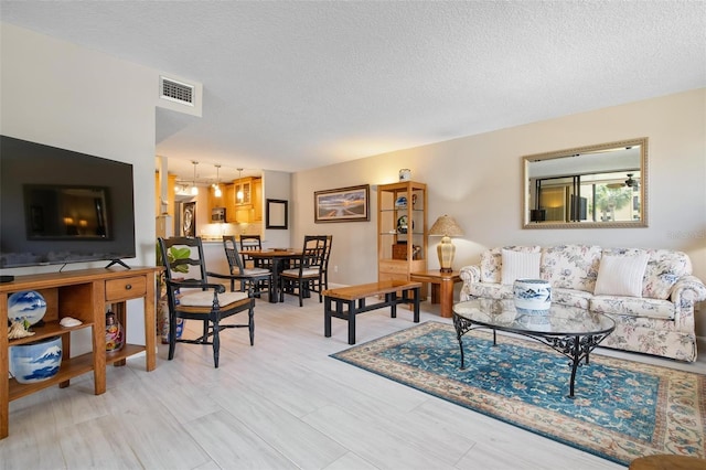 living room with a textured ceiling