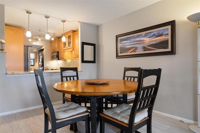 dining space featuring light hardwood / wood-style flooring