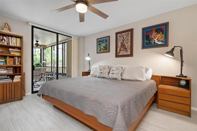 bedroom featuring access to exterior, light hardwood / wood-style floors, and ceiling fan