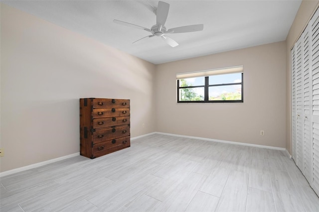 unfurnished bedroom with light wood-type flooring, a closet, and ceiling fan