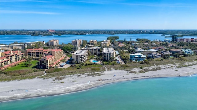 birds eye view of property featuring a water view and a view of the beach