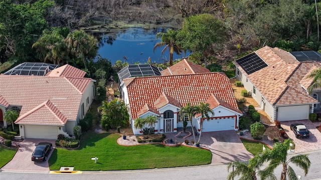 bird's eye view with a water view