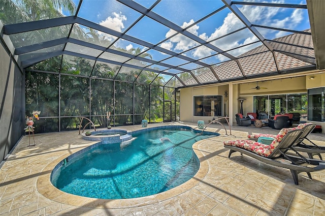 view of pool featuring an in ground hot tub, glass enclosure, ceiling fan, and a patio area