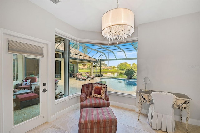 interior space featuring a water view, light tile patterned flooring, and a notable chandelier