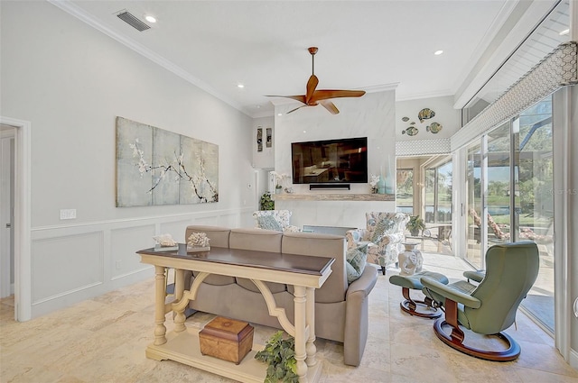 interior space featuring ceiling fan and ornamental molding