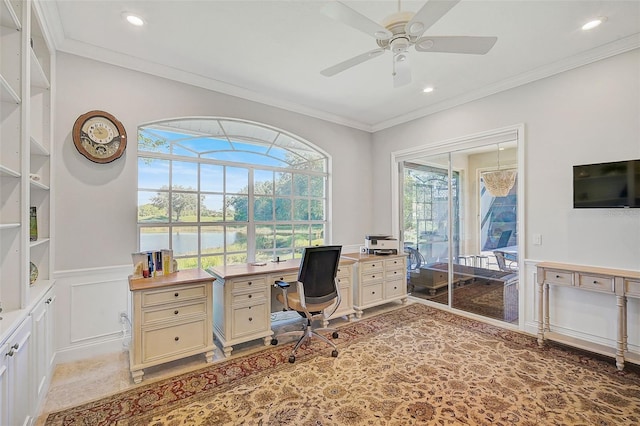 office with a water view, ceiling fan, and crown molding