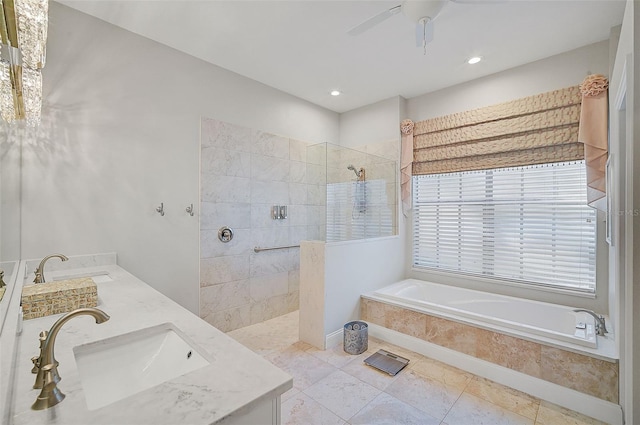 bathroom with ceiling fan, vanity, and independent shower and bath