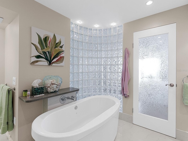 bathroom with a washtub