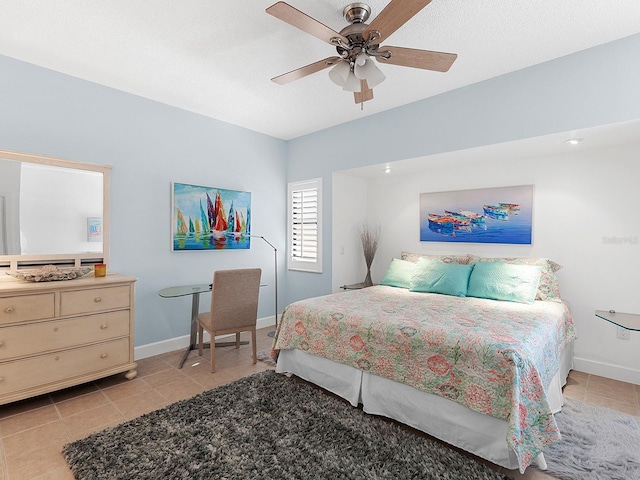 bedroom with ceiling fan and light tile patterned flooring