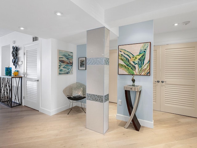 hallway featuring light hardwood / wood-style flooring