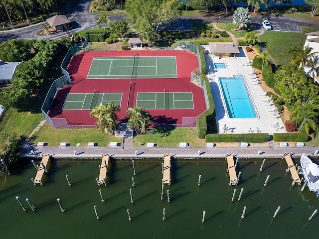 birds eye view of property with a water view