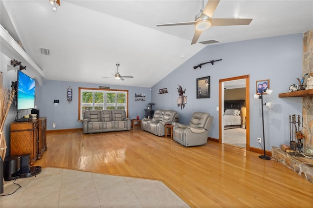 living room with vaulted ceiling, ceiling fan, and light hardwood / wood-style floors