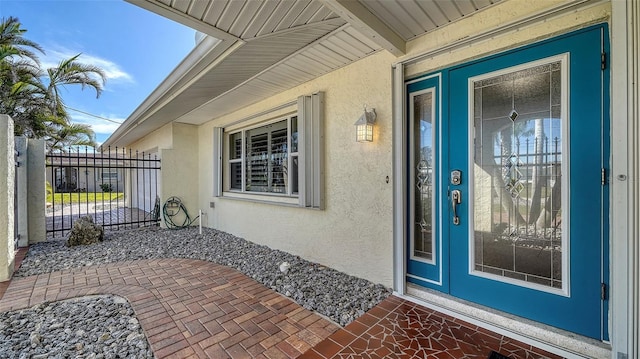 property entrance featuring a patio area