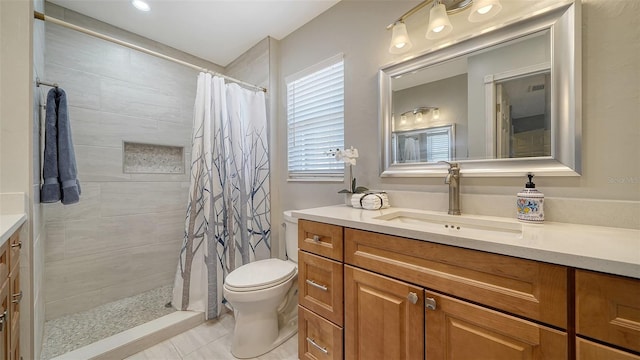 bathroom featuring vanity, toilet, and a shower with shower curtain