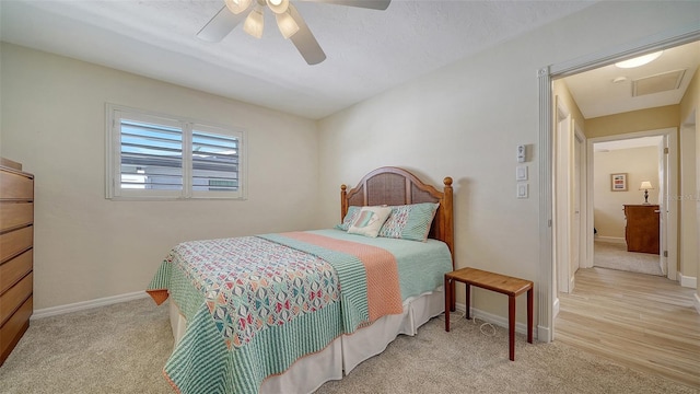 bedroom featuring ceiling fan and light colored carpet