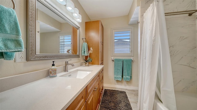 bathroom with vanity and shower / bath combo with shower curtain