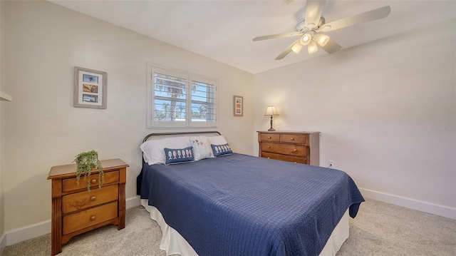 bedroom with light colored carpet and ceiling fan