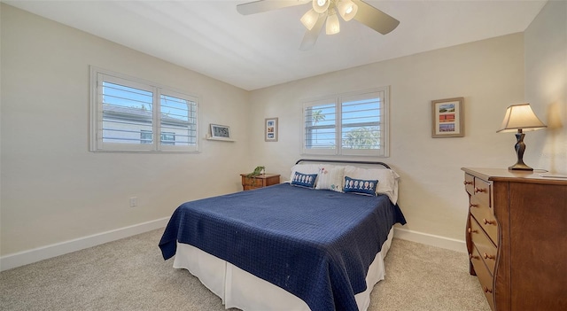 bedroom with light colored carpet and ceiling fan