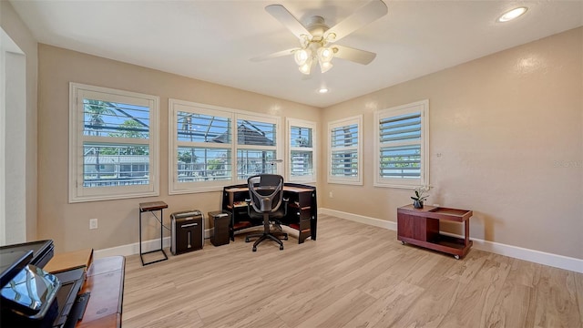 office with ceiling fan, a healthy amount of sunlight, and light wood-type flooring