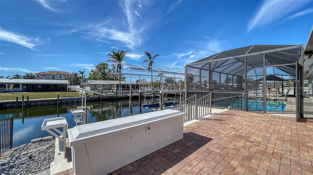 view of dock featuring a lanai, a patio, and a water view