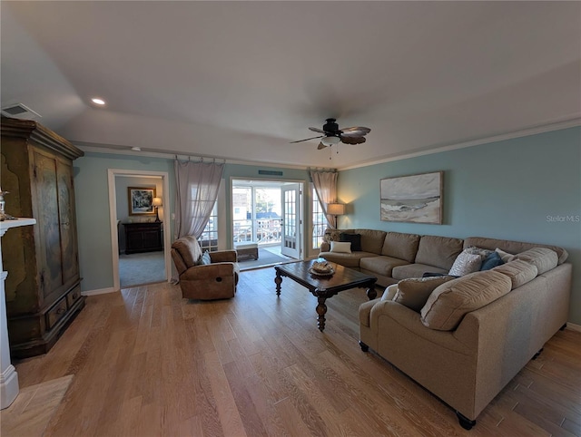 living room featuring ceiling fan and light hardwood / wood-style flooring