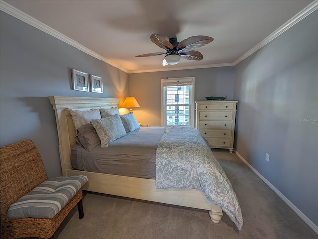 carpeted bedroom featuring ceiling fan and crown molding