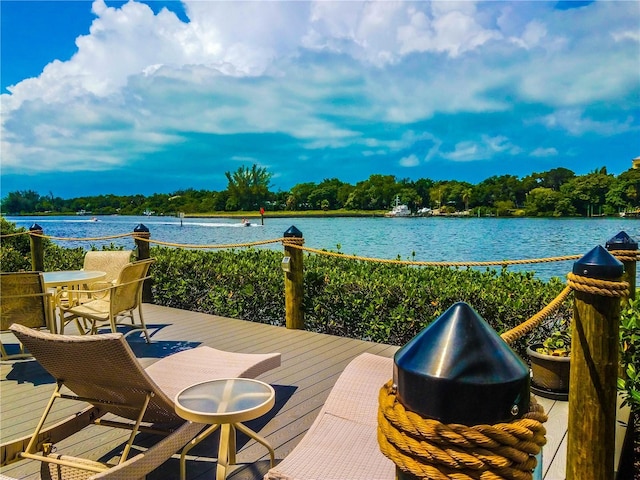 wooden terrace with a water view