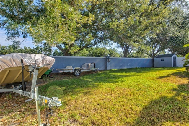 view of yard with a storage unit