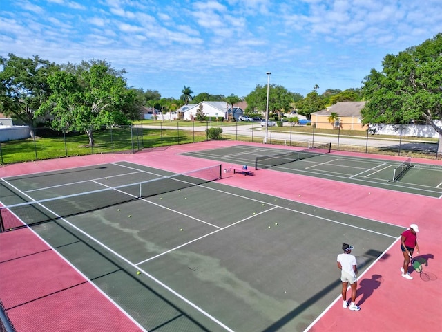 view of sport court with basketball hoop