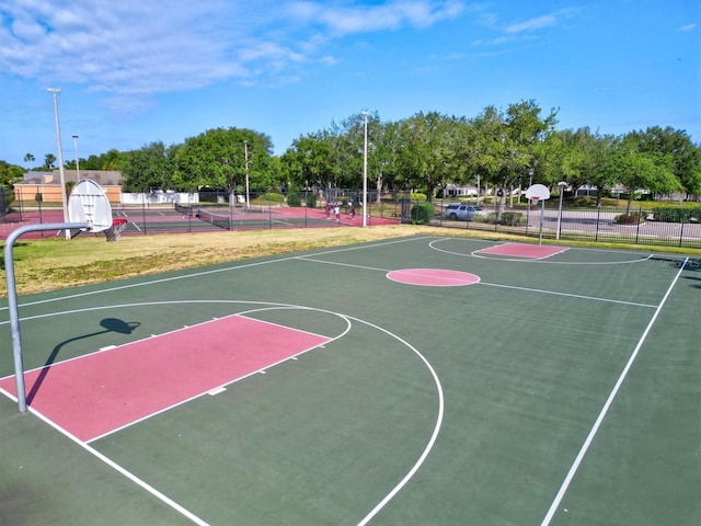 view of basketball court featuring tennis court