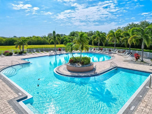 view of swimming pool with a patio