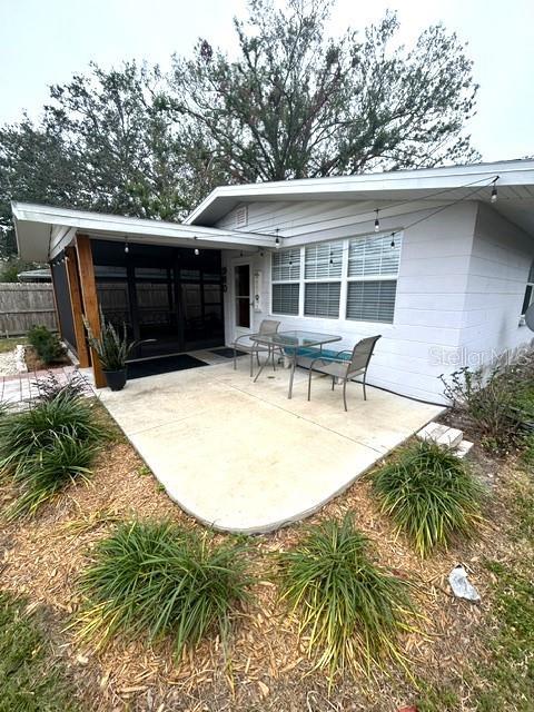 rear view of property featuring a patio area