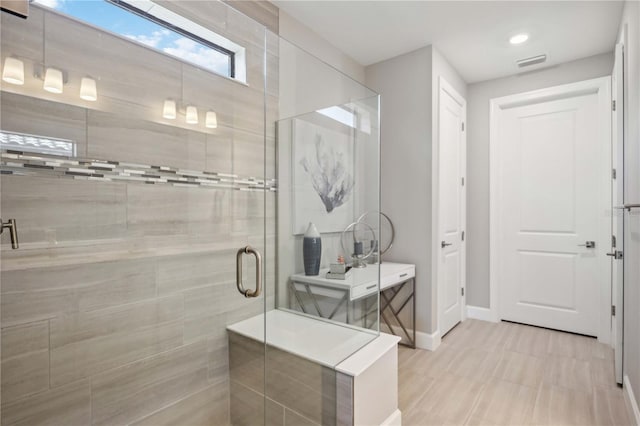 bathroom featuring walk in shower