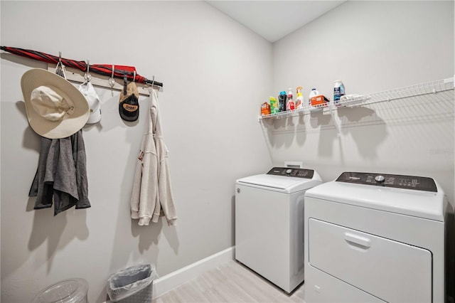 washroom featuring light wood-type flooring and independent washer and dryer