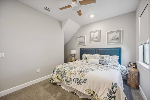 carpeted bedroom featuring ceiling fan and vaulted ceiling