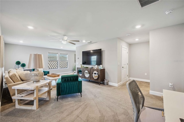 living room featuring light carpet and ceiling fan